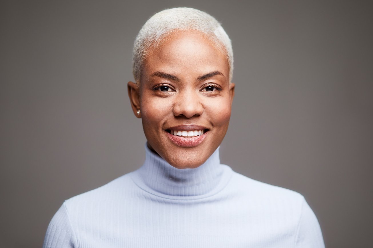 Woman's headshot on plain background