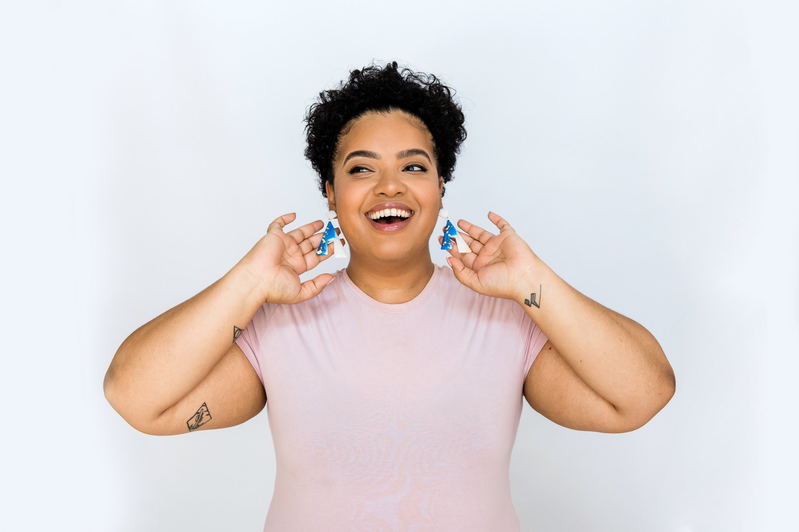 Joyful Woman Wearing Blue Earrings 